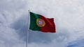 Low angle shot of the National Flag of Portugal under a cloudy sky background Royalty Free Stock Photo