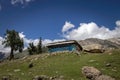 Low angle shot of an old stone shed on a rural mountainside in Kashmir, India Royalty Free Stock Photo