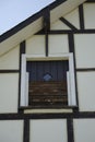 Low angle shot of an old wooden window of a house in Dahlbruch, Germany Royalty Free Stock Photo