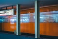 the view of an orange subway moving down the tracks in the night Royalty Free Stock Photo