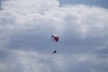 Low angle shot of a person paragliding at daytime