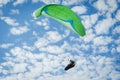 Low angle shot of a person paragliding in the sky - freedom concept