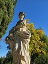 Low-angle shot of Pomona goddess statue in the garden Royalty Free Stock Photo