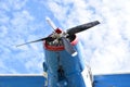 Low angle shot of the propeller of a vintage plane under a blue sky