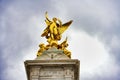 Low angle shot of Queen Victoria Memorial.Golden monument winged statue angel near Buckingham Palace