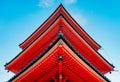 Low angle shot of red and blue Buddhist Kiyomizu-Dera temple in Eastern Kyoto under the clear sky Royalty Free Stock Photo