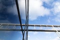 Low angle shot of a reflective glass building wall under the blue sky Royalty Free Stock Photo