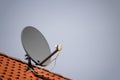 Low angle shot of a rooftop satellite