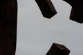 Low angle shot of rusty metal formations under a clear sky