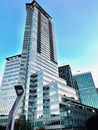 Low-angle shot of the Shaw Tower in Vancouver Canada against the blue sunny sky