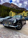 Low angle shot of a shiny dark blue Austin Martin classic car DB5