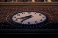 Low angle shot of a simple clock on a building