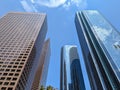 Low-angle shot of skyscrapers in Los Angeles with blue sky and clouds reflecting in windows Royalty Free Stock Photo