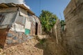 Low angle shot of a small house in a poor neighborhood Royalty Free Stock Photo