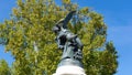 Low-angle shot of a statue of a fallen angel in the Retiro Park, Madrid, Spain Royalty Free Stock Photo