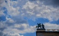 Low angle shot of a statue of a horse with wings and man in the streets on Berlin, Germany