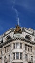 Low angle shot of statue of Justice on top of building on corner of Piccadilly and St James Street