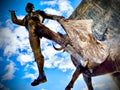Low-angle shot of a statue of a matador with a bull. The plaza de toros de Las Ventas.