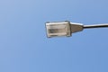 Low angle shot of a street lamp post with the clear blue sky on the background Royalty Free Stock Photo