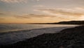 Low angle shot of sunset on a pebble beach of Nice