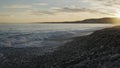 Low angle shot of sunset on a pebble beach of Nice