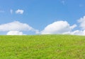 Low angle shot of the top of a hill with grassy field Royalty Free Stock Photo