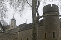 Low angle shot of a Tower of London, United Kingdom with a gray sky in the background Royalty Free Stock Photo