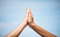 Youve gotta believe to achieve. Low angle shot of two unrecognizable women highfiving outside. Royalty Free Stock Photo