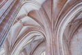 Low angle shot of the white columns and the ceiling of an old building Royalty Free Stock Photo