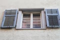 Low angle shot of a window with the shutters open in Italy Royalty Free Stock Photo