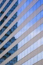 Abstract reflection pattern of high office building on blue glass wall surface of skyscraper Royalty Free Stock Photo