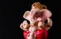 Low angle side view close up of beautiful ganesha statue in blessing pose. hinduism concept