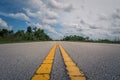Low angle straight empty long asphalt road in Everglades National Park, Florida, USA Royalty Free Stock Photo