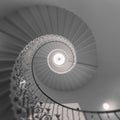 Low-angle of stunning spiral English staircase with intricate designs Royalty Free Stock Photo