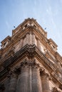 Low angle vertical shot of an ancient beautifully architectured building in Malaga, Spai