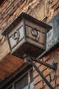 Low angle vertical shot of an old wall lamp with a block number nine Royalty Free Stock Photo