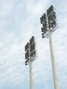 Low angle vertical shot of posted stadium lights