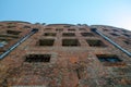 Low Angle View Of Abandoned Brick House With Broken Windows with Royalty Free Stock Photo