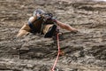 Traditional outdoor rock climber ascends