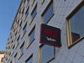 Low angle view of advertisement sign and logo at the facade of new hotel Radisson Red Vienna in Austria.