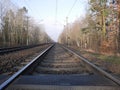 Low angle view along a deserted railway track Royalty Free Stock Photo