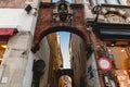 low angle view of arches and narrow street with old houses Royalty Free Stock Photo