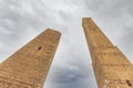 Low angle view of Asinelli (right) and Garisenda (left) towes against cloudy sky. Bologna, Italy Royalty Free Stock Photo