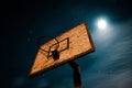 Low angle view of a basketball hoop against starry sky at night Royalty Free Stock Photo