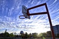 Low angle view of the basketball hoop with a blue sky background Royalty Free Stock Photo