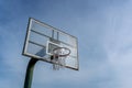 Low angle view of basketball ring on sky background. Outdoor basketball hoop Royalty Free Stock Photo