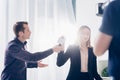 Low angle view of beautiful businesswoman in suit rejecting giving interview to journalist Royalty Free Stock Photo