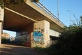 Low angle view of a bridge underpass with graffiti covered walls