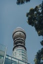 Low angle view of BT Tower in Fitzrovia, London, UK, against blue sky