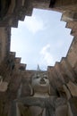 Low angle view of the Buddha statue of Wat Si Chum in Sukhothai Historical Park Royalty Free Stock Photo